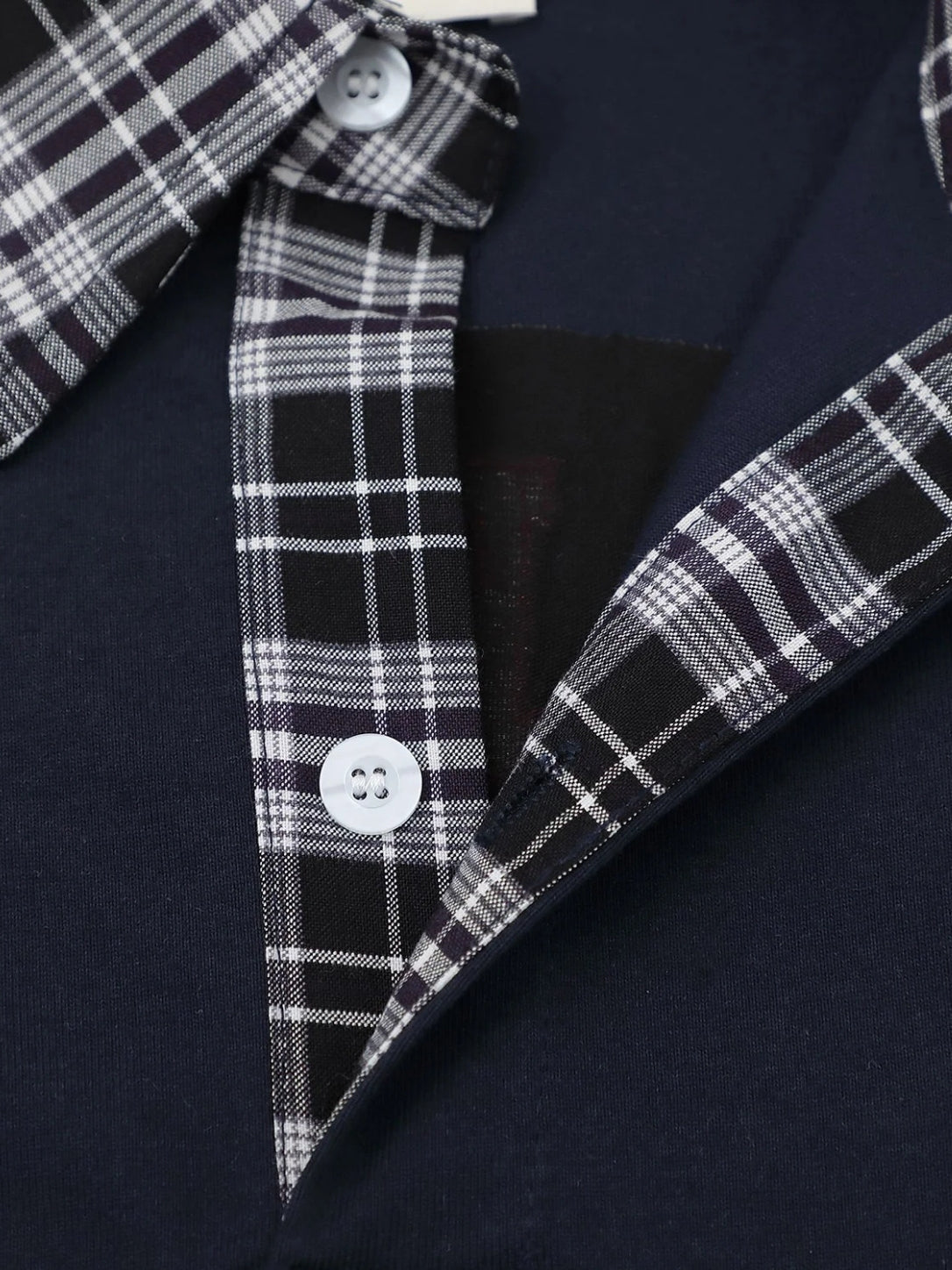 Polo shirt cuffs and plaid sleeve detail