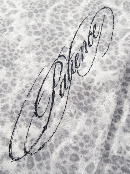 Detail of the sleeve and distressed finish on the leopard print top