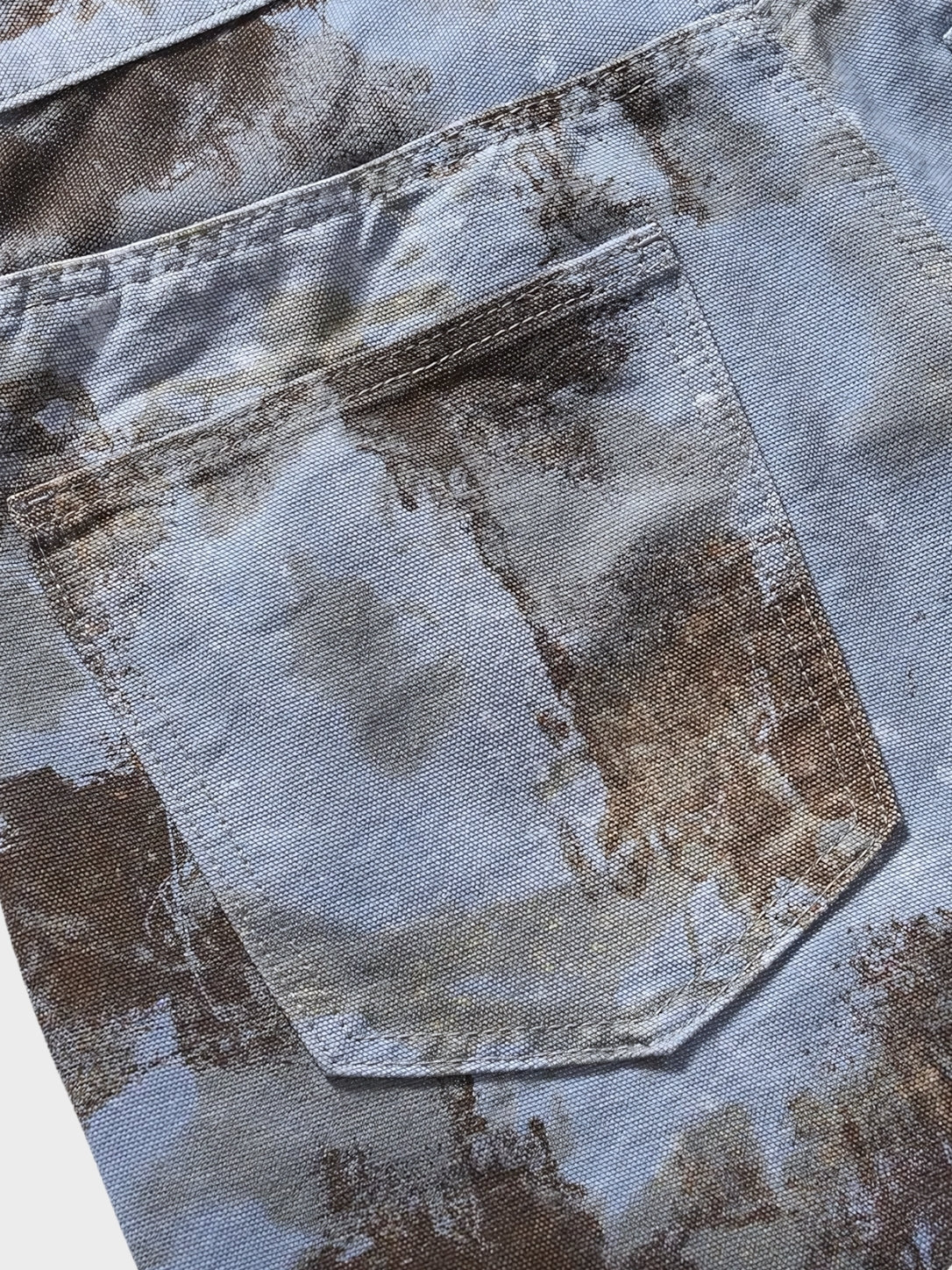 Close-up of waistband and fastening on men's black denim jorts