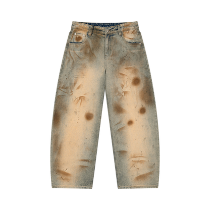 Barrel leg jeans with distressed details shown on a model