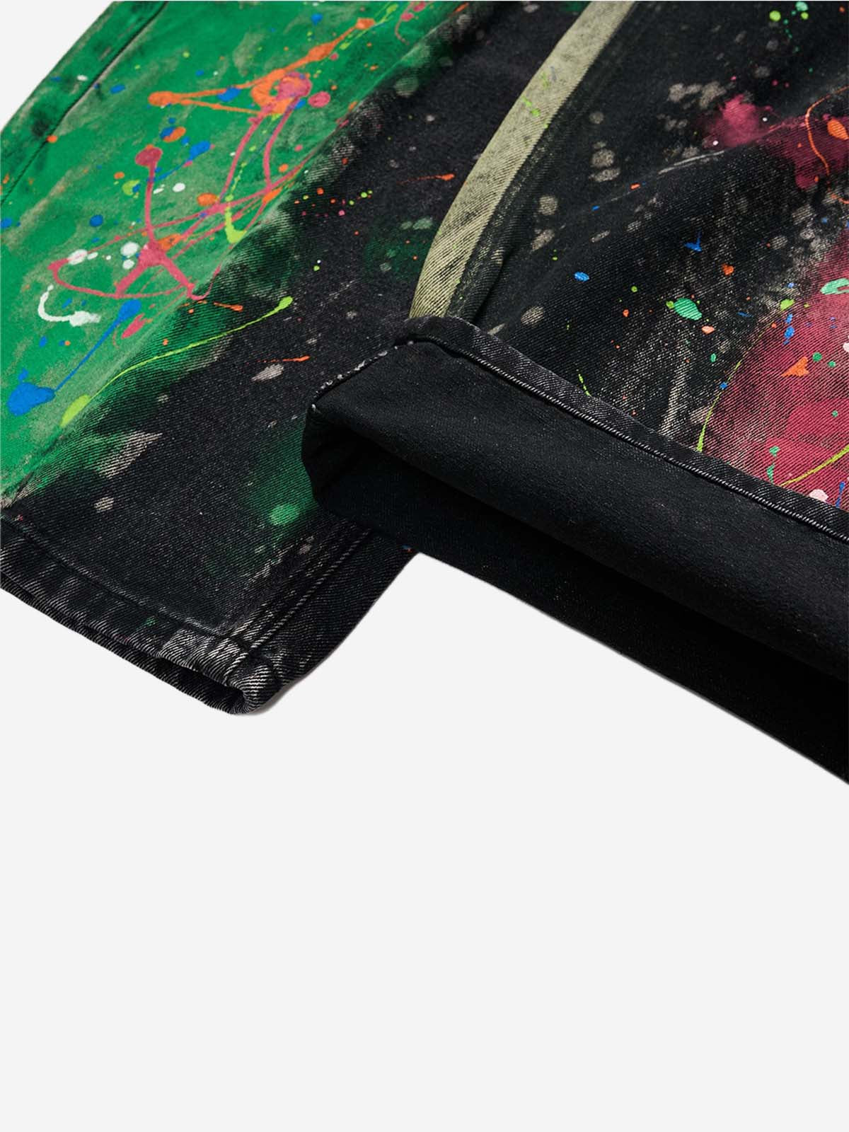Relaxed wide-leg silhouette of artistic paint-splatter jeans