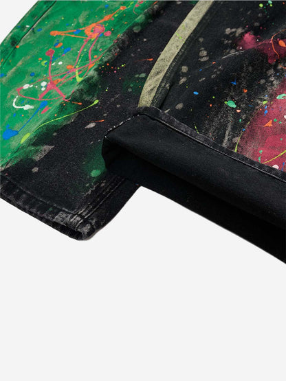 Relaxed wide-leg silhouette of artistic paint-splatter jeans