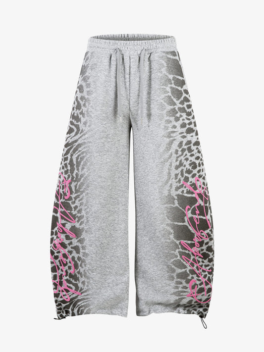 Front view of leopard print wide-leg joggers with drawstring waist