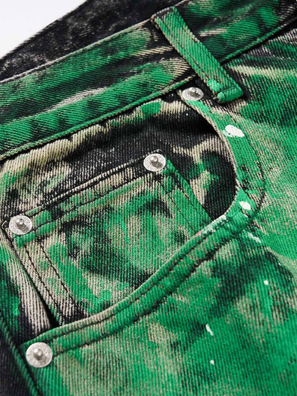 Close-up of paint-splatter detailing on denim jeans
