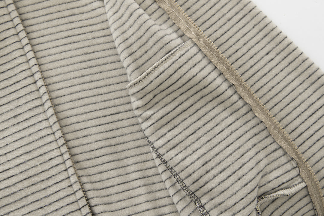 Side view of the striped hoodie with practical pockets