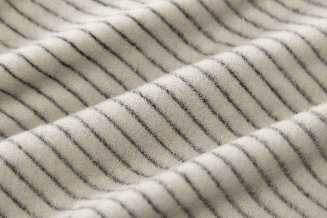Full product view of the striped zip-up hooded top