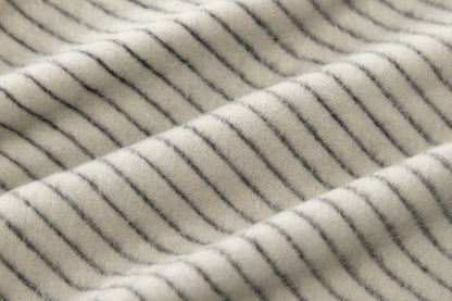 Full product view of the striped zip-up hooded top