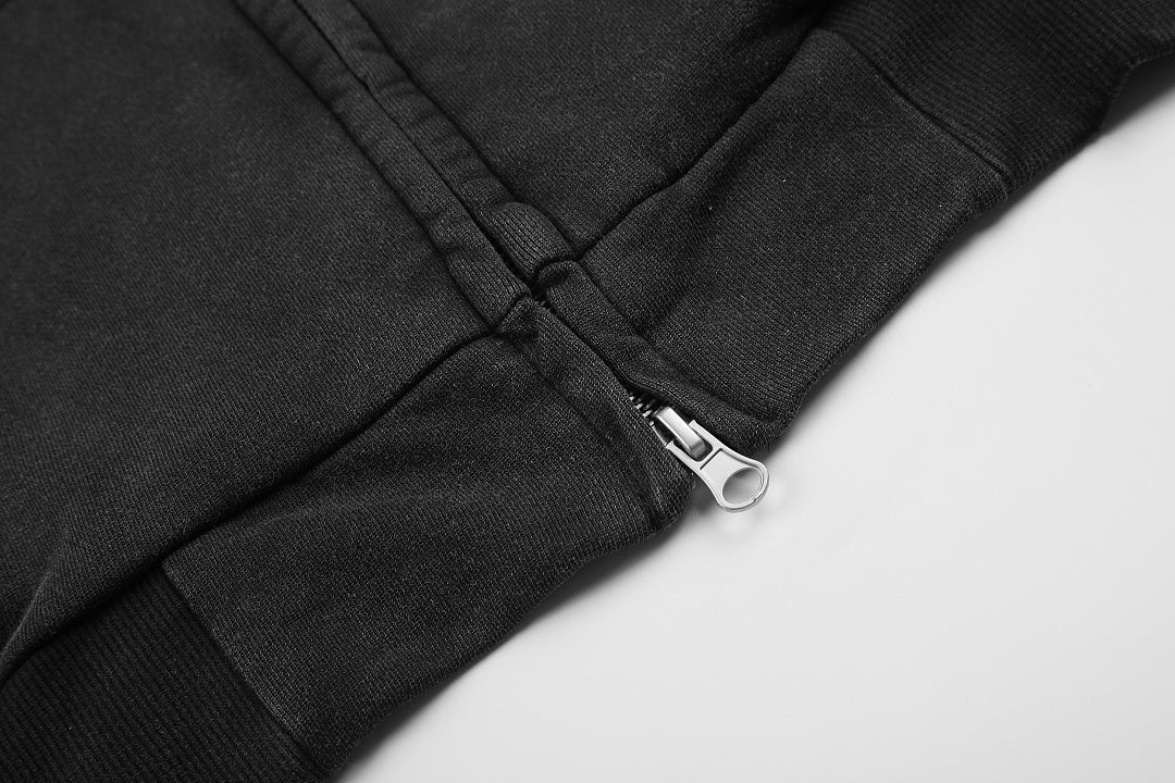 Detail of the zip fastening and front pocket on the graphic hoodie