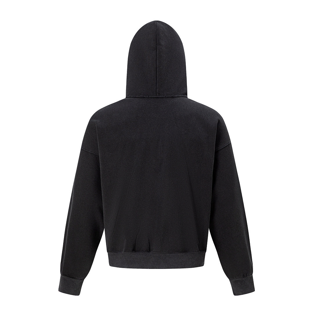 Close-up of the hoodie zip fastening and distressed graphic design