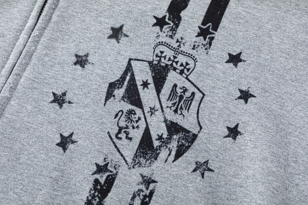 Side view showing the relaxed shape of the graphic zip-up hoodie