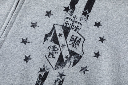 Side view showing the relaxed shape of the graphic zip-up hoodie