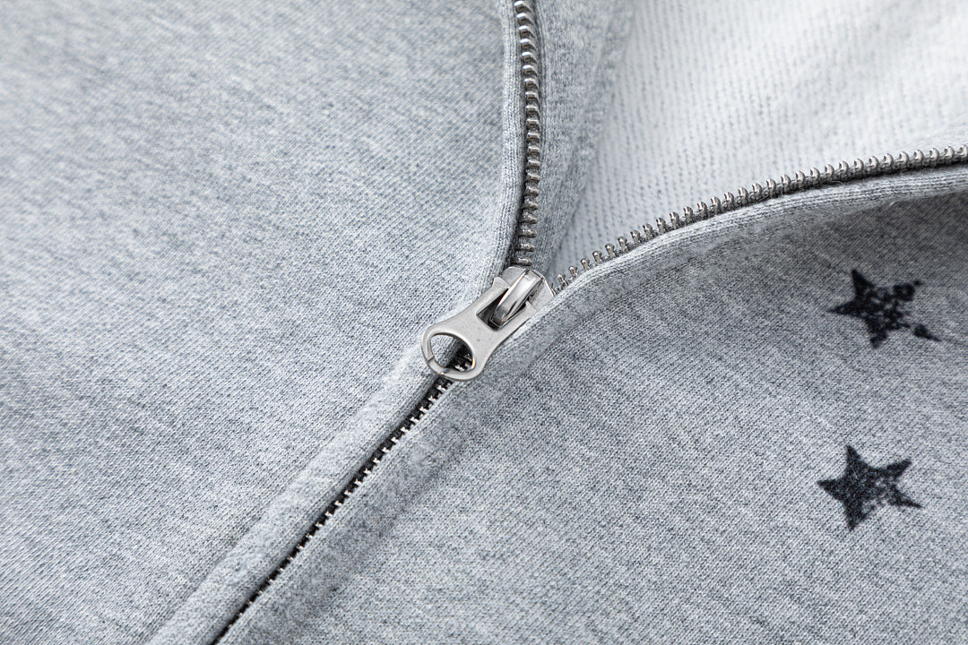 Detail of the sleeve and cuff on the distressed graphic hoodie