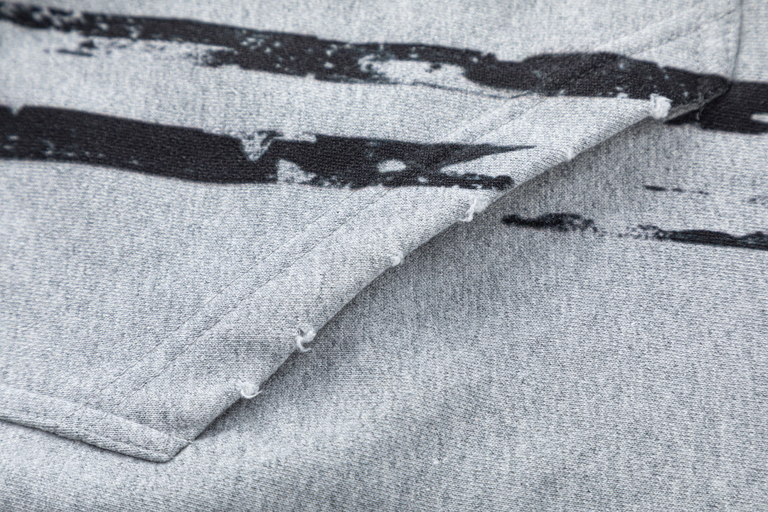 Close-up of the hood and drawstring detail on the zip-up hoodie
