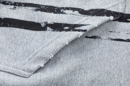 Close-up of the hood and drawstring detail on the zip-up hoodie