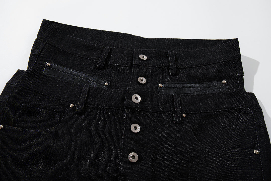 Close-up of the double waistband on barrel-leg jeans