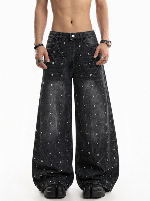 Studded washed black baggy jeans shown from the front