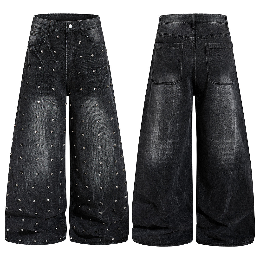 Close-up of studs on washed black baggy denim