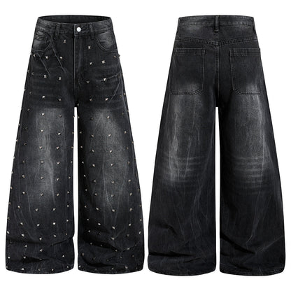 Close-up of studs on washed black baggy denim