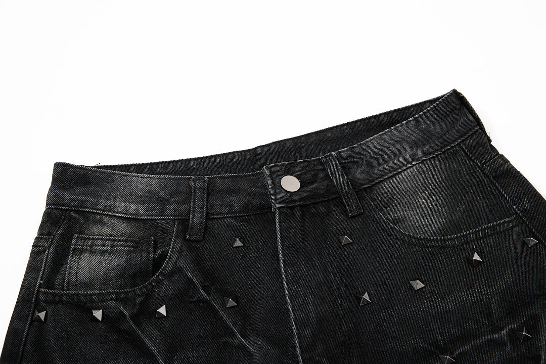 Side view of studded washed black baggy jeans
