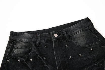 Side view of studded washed black baggy jeans