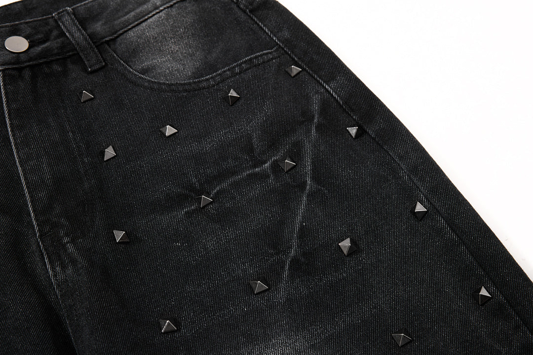 Rear pocket detail on studded washed black jeans