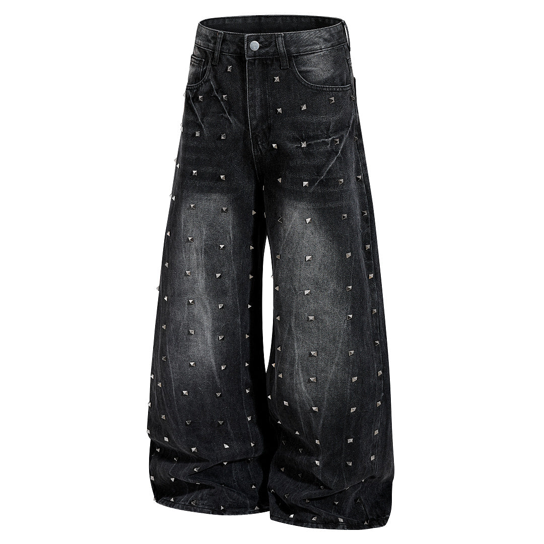 Waistband and belt loop detail on black baggy jeans