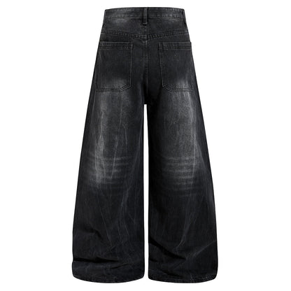 Full-length view of relaxed studded washed black jeans
