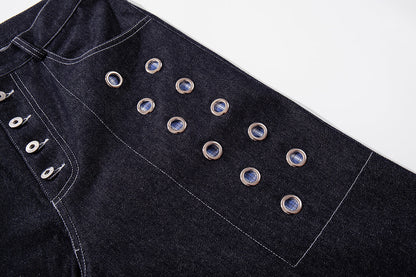 Side view of grommet baggy jeans showing the loose leg shape
