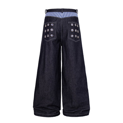 Detailed view of the grommet embellishments on the jeans
