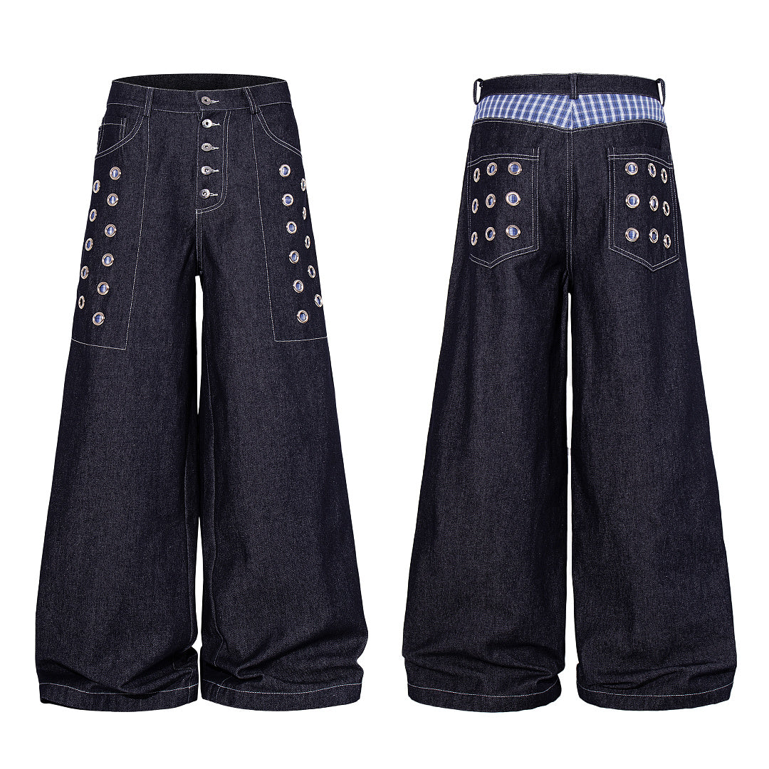 Close-up of the denim texture and stitching on the baggy jeans