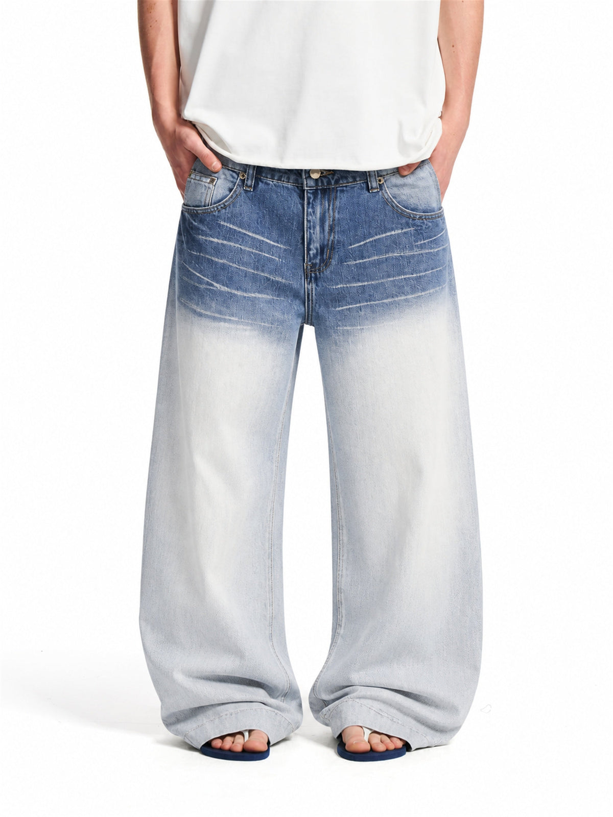 Front view of gradient baggy jeans with whisker detail