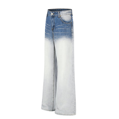 Close-up of whisker detail on gradient denim jeans