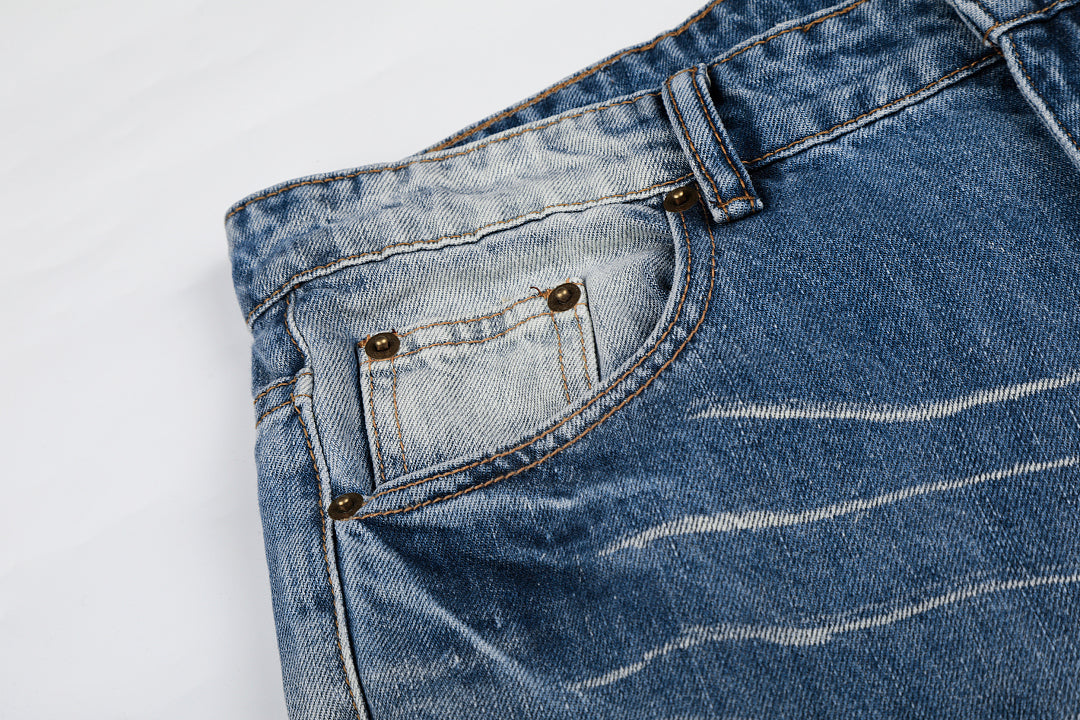 Waistband and fastening detail on gradient baggy jeans