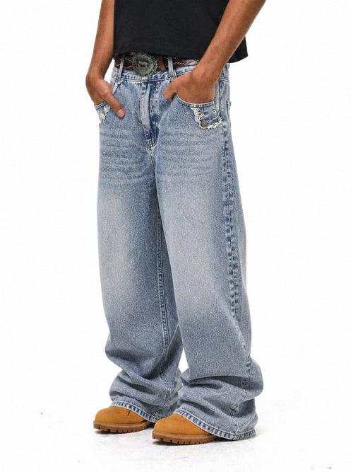 Baggy washed frayed jeans with a relaxed wide-leg silhouette