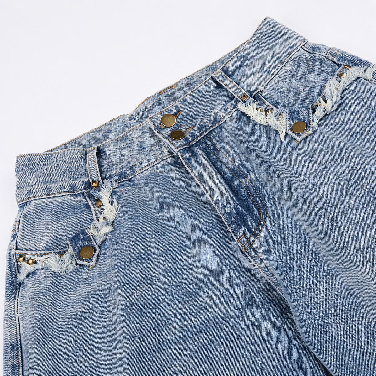 Washed denim jeans with a loose fit and distressed frayed detailing