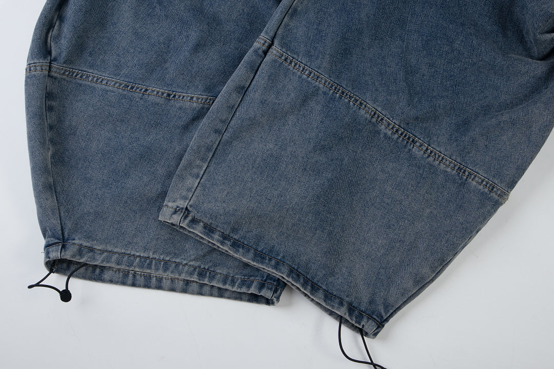 Waistband and front pockets on baggy jeans