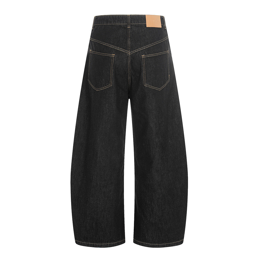 Side view of baggy jeans featuring metal clasp fastening