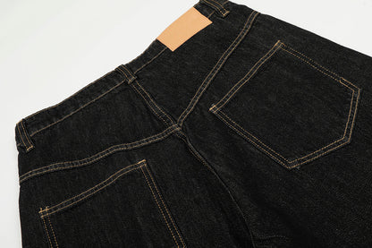 Detail of the waistband and metal clasp fastening on the jeans