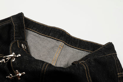 Full-length view of baggy jeans with statement clasp details