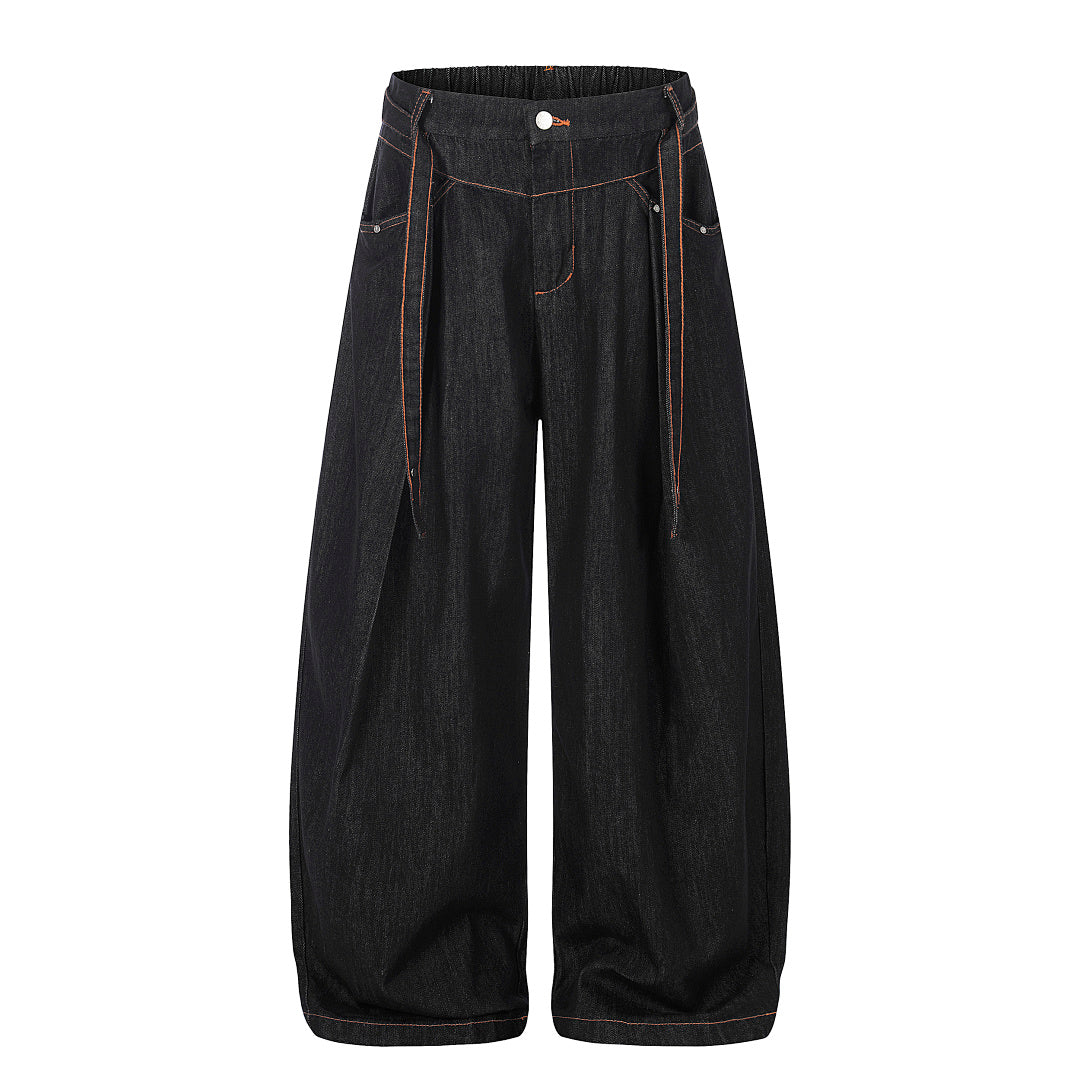 Pleated baggy barrel jeans showing the relaxed streetwear fit