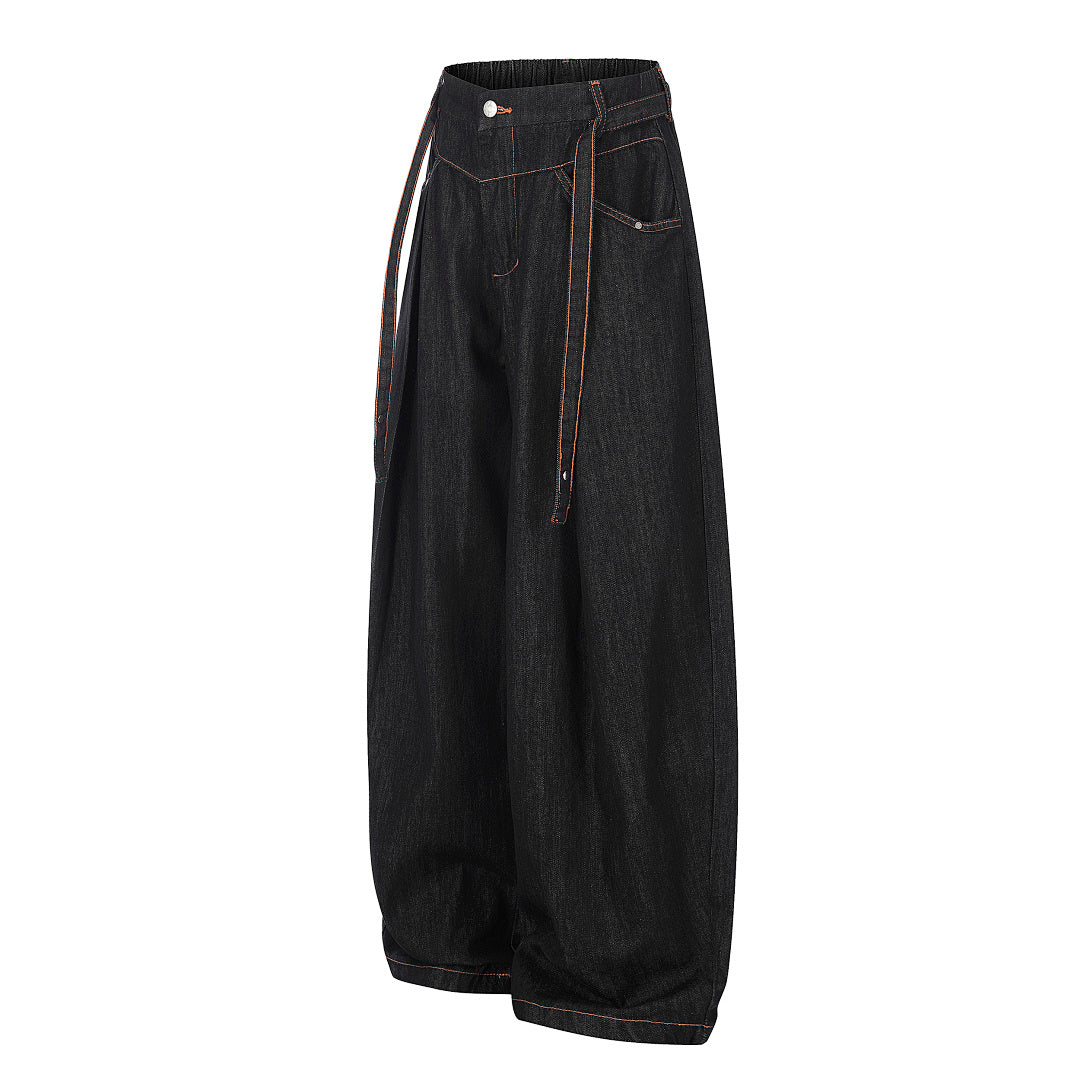Side view of relaxed pleated barrel-leg jeans