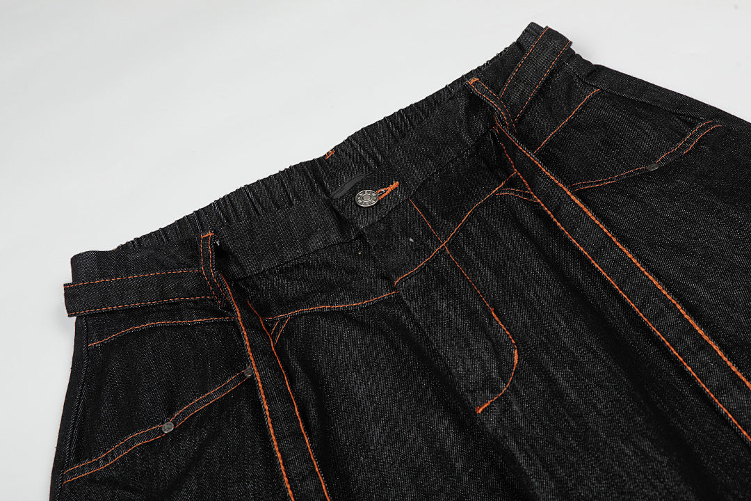 Close-up of pleated detailing on baggy barrel jeans