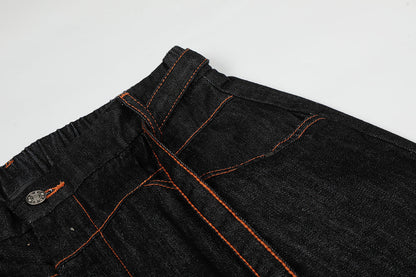 Waist and front pocket details on pleated barrel jeans