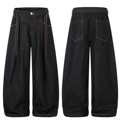 Relaxed pleated barrel jeans shown in a complete outfit