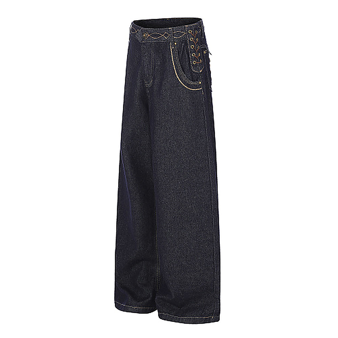 Close-up of the lace-up pocket detail on the jeans
