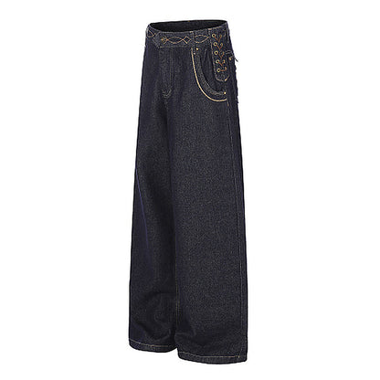 Close-up of the lace-up pocket detail on the jeans