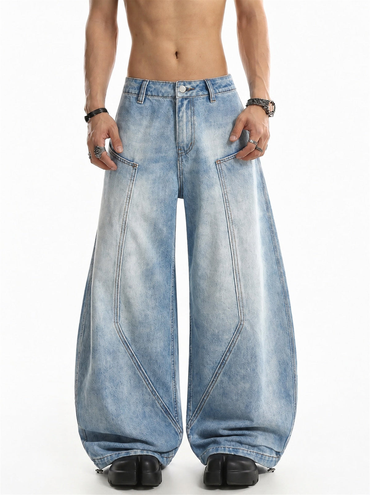 Front view of baggy barrel jeans with curved seam panels