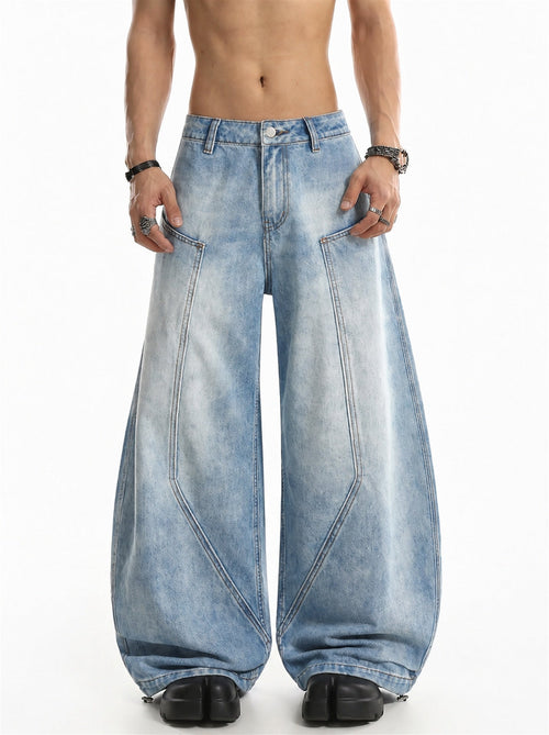 Front view of baggy barrel jeans with curved seam panels