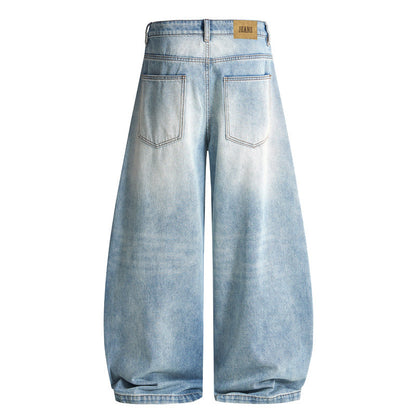 Side view of baggy barrel jeans with curved seam detailing