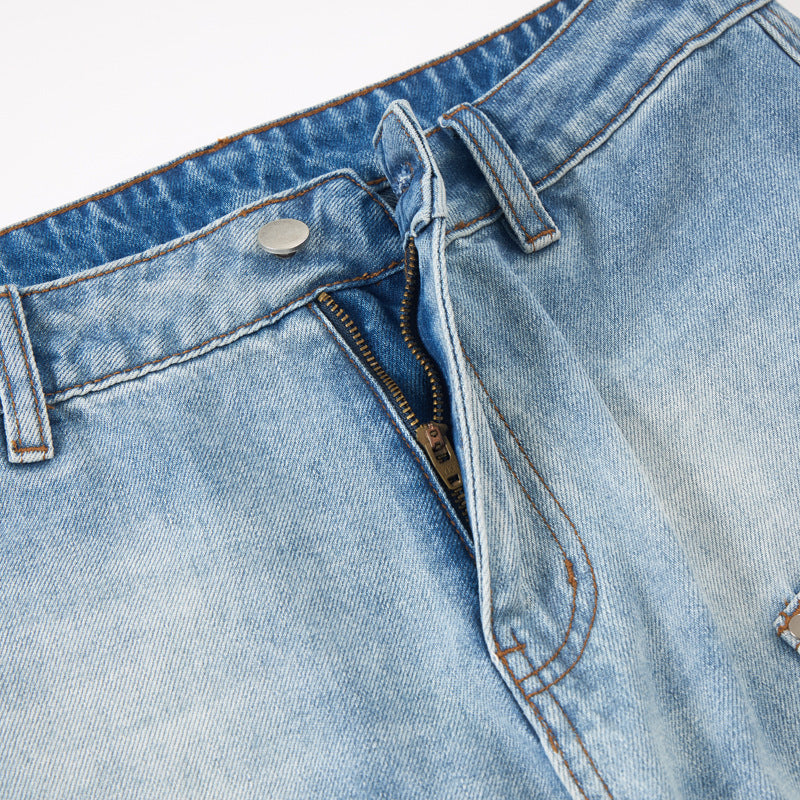 Detail view of the waistband and pocket design on the jeans